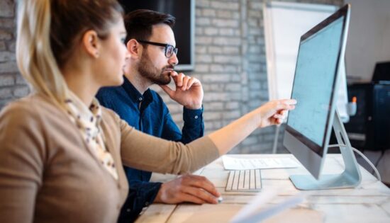 Software engineers working on project and programming in company